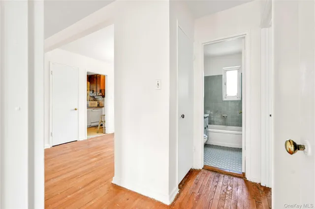 a view of a bathroom with a tub and shower curtain
