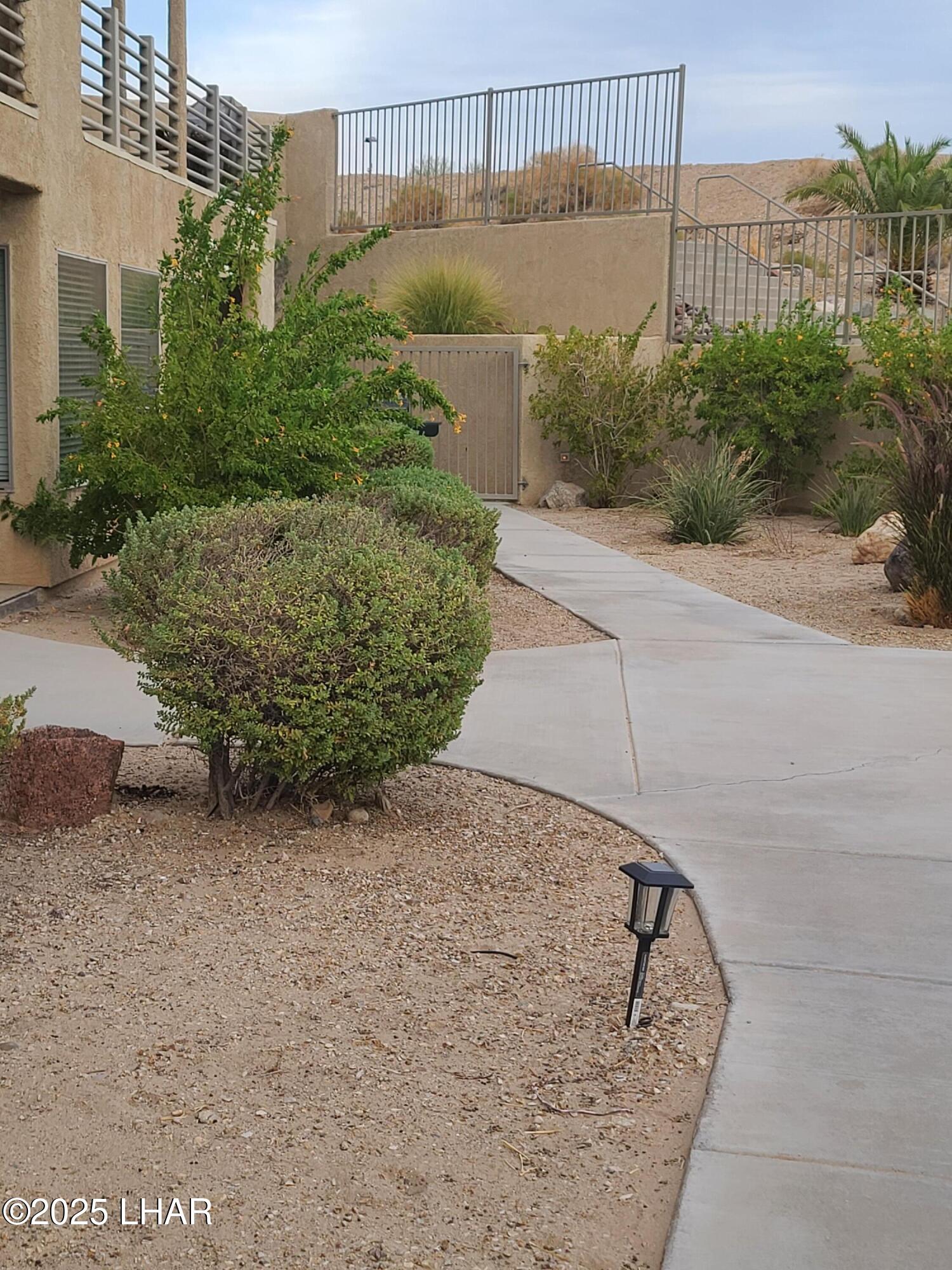 94 London Bridge Road, Unit 108 Lake Havasu City, AZ 86403 - Photo 7 of 38 a view of a pathway both side of building