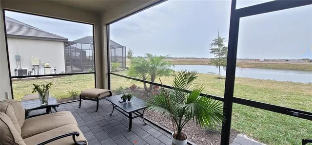 a view of sitting area with furniture and wooden floor