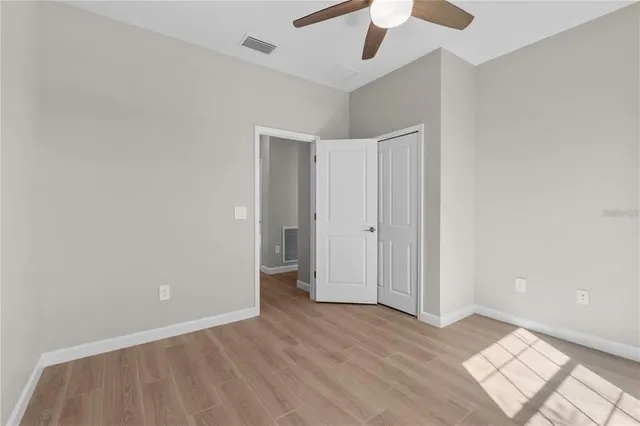 a bathroom with a toilet a sink and a mirror