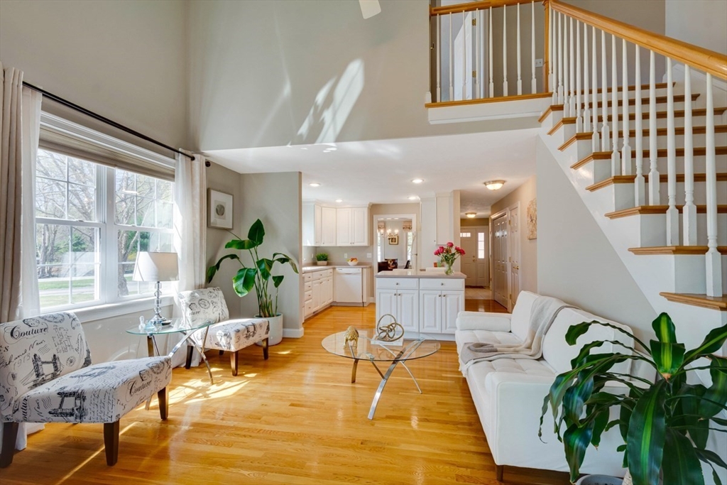 98 Summer Road, Unit 98 Boxborough, MA 01719 - Photo 12 of 27 a living room with patio furniture