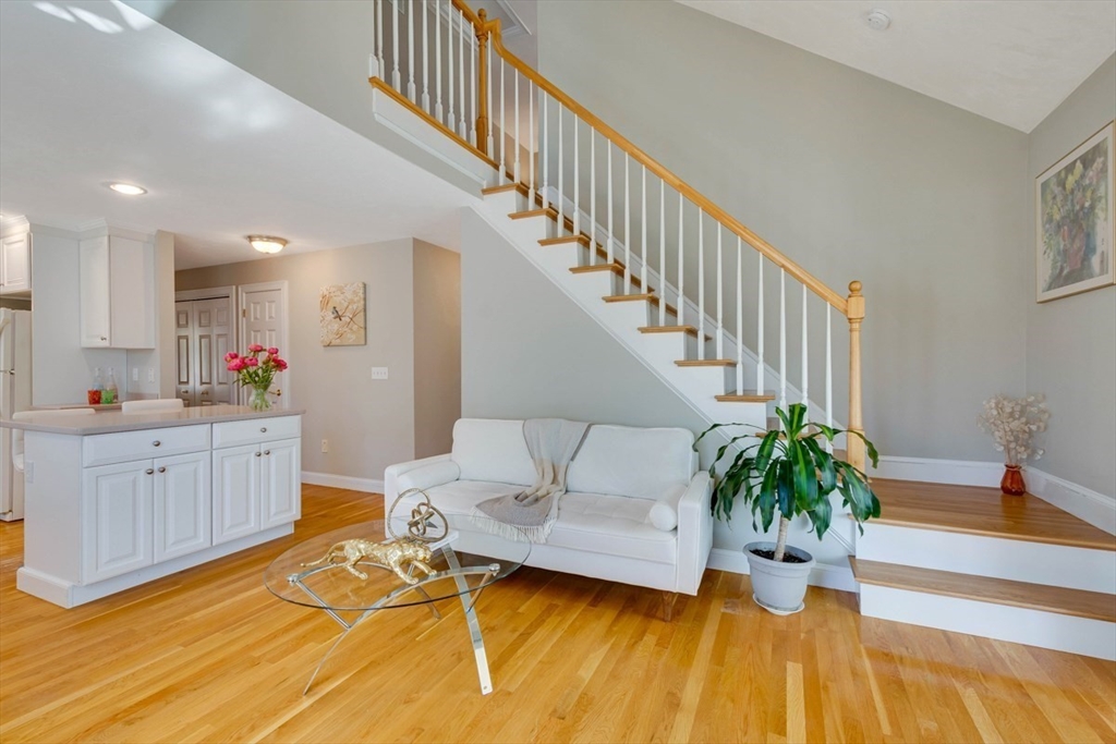 98 Summer Road, Unit 98 Boxborough, MA 01719 - Photo 13 of 27 a view of a kitchen with furniture and a potted plant