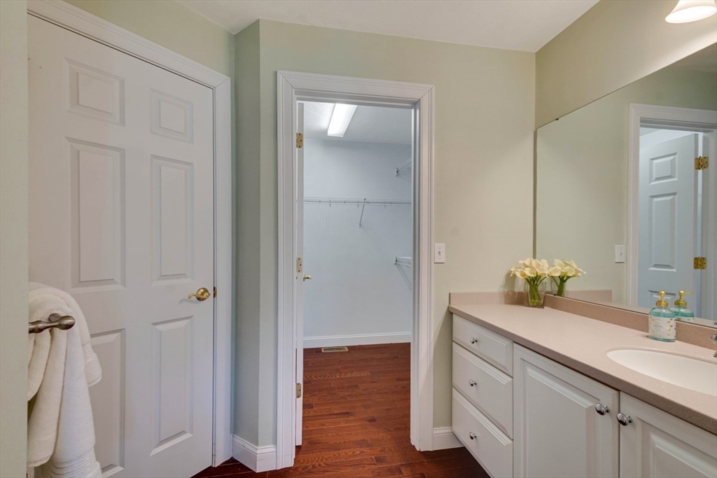 98 Summer Road, Unit 98 Boxborough, MA 01719 - Photo 19 of 27 a bathroom with a sink and mirror