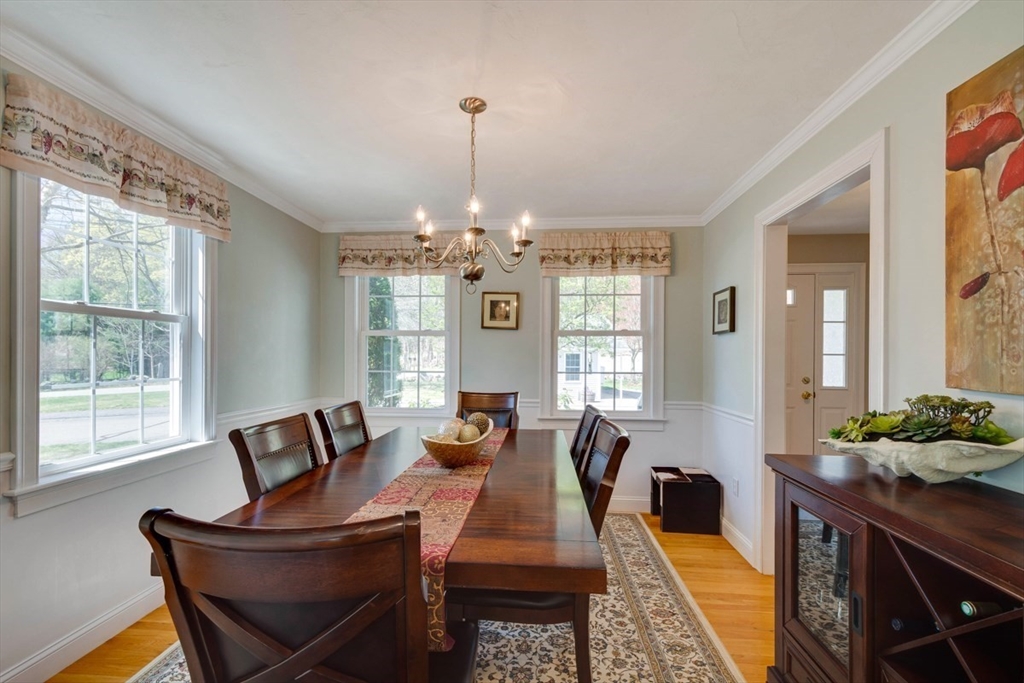 98 Summer Road, Unit 98 Boxborough, MA 01719 - Photo 5 of 27 a living room with furniture dining table and a chandelier