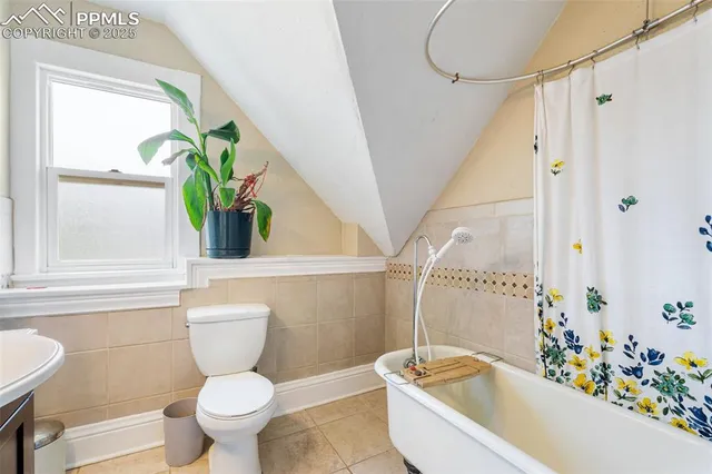 a bathroom with a toilet sink and tub