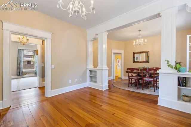 a view of a livingroom with furniture window and wooden floor