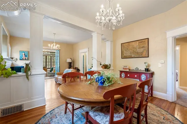 a view of a dining room with furniture and wooden floor