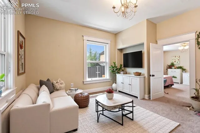 a living room with furniture and a flat screen tv