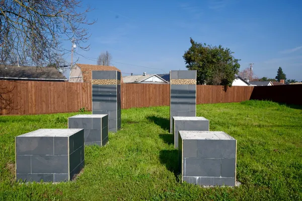 a view of a backyard with wooden fence