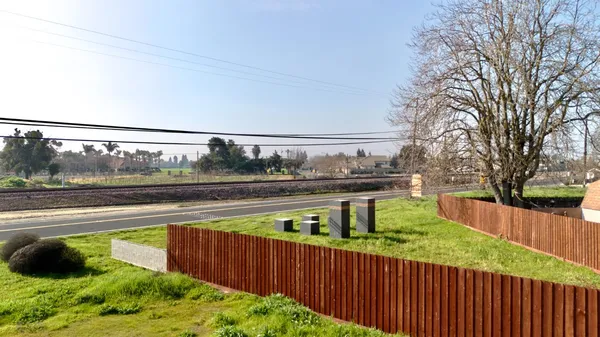 a backyard of a house with lots of green space