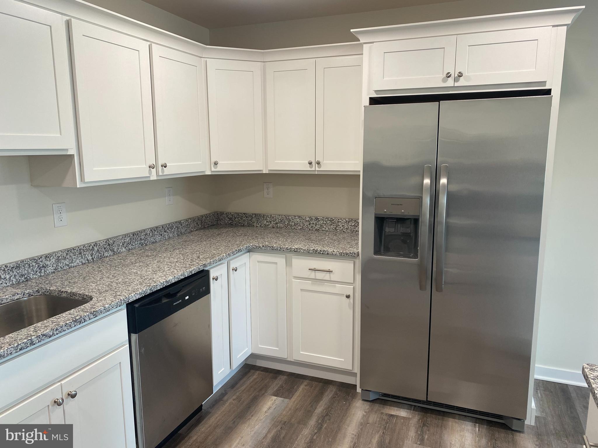 3852 Ridge Pike, Unit 3852 Collegeville, PA 19426 - Photo 12 of 24 a kitchen with a refrigerator sink and cabinets