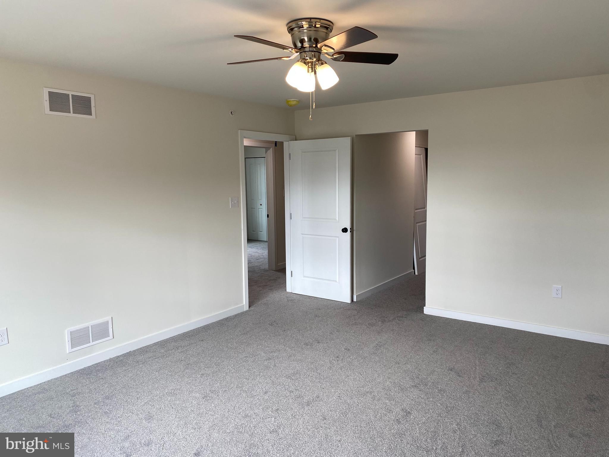 3852 Ridge Pike, Unit 3852 Collegeville, PA 19426 - Photo 16 of 24 a view of an empty room and a ceiling fan