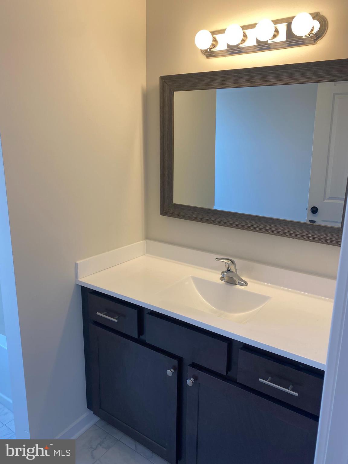 3852 Ridge Pike, Unit 3852 Collegeville, PA 19426 - Photo 23 of 24 a bathroom with a sink and a mirror