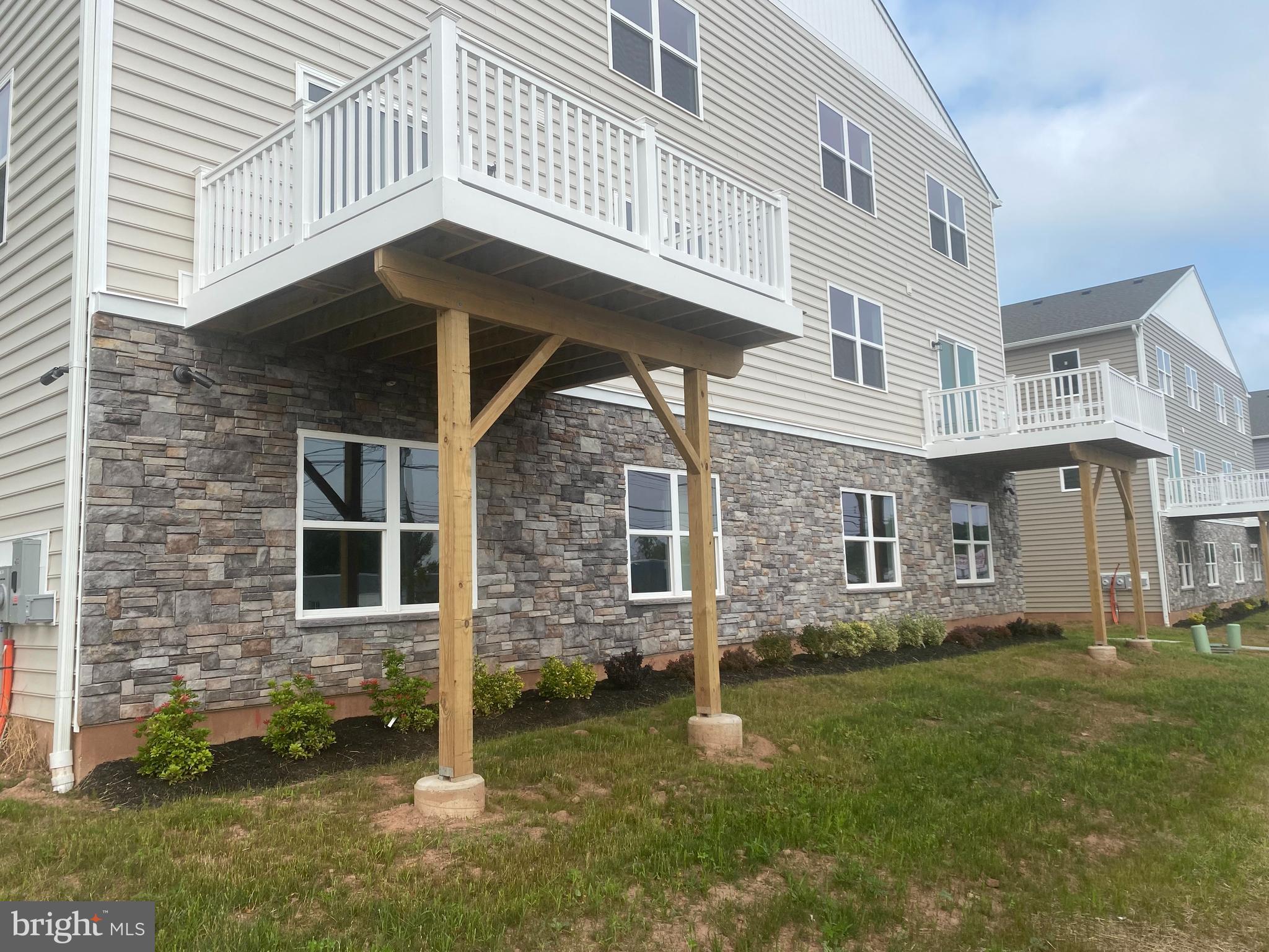 3852 Ridge Pike, Unit 3852 Collegeville, PA 19426 - Photo 3 of 24 a view of a house with a yard