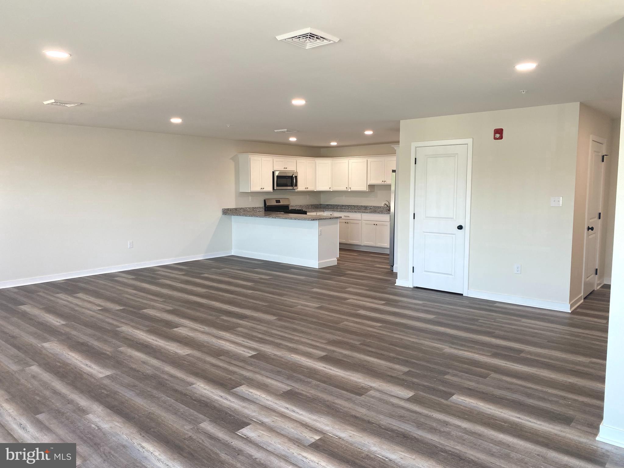 3852 Ridge Pike, Unit 3852 Collegeville, PA 19426 - Photo 6 of 24 a large kitchen with kitchen island a sink stainless steel appliances and cabinets