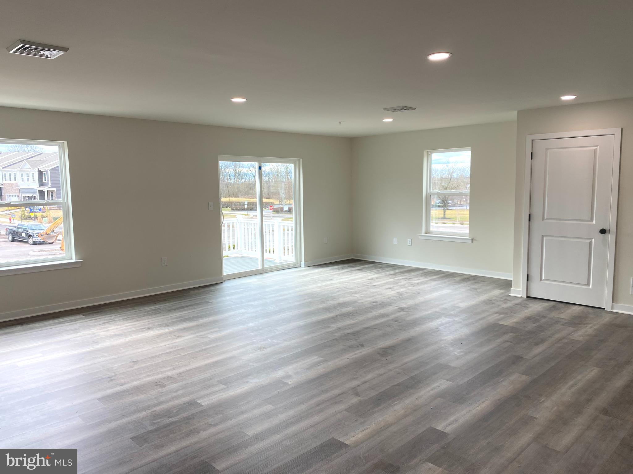 3852 Ridge Pike, Unit 3852 Collegeville, PA 19426 - Photo 8 of 24 a view of an empty room with wooden floor and window
