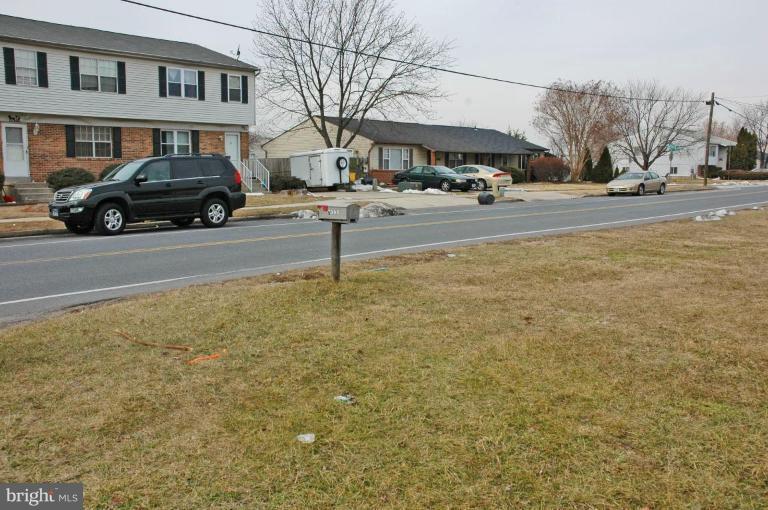7995 Tick Neck Road Pasadena, MD 21122 - Photo 2 of 3 a car parked in front of a building