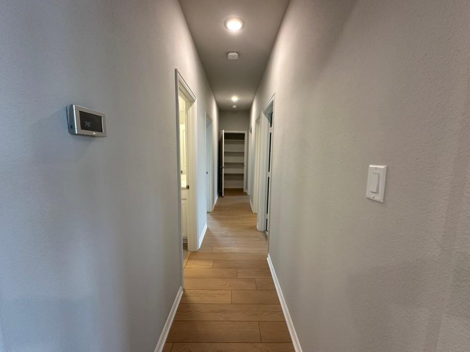 2472 Black Jack Oak Road Terrell, TX 75161 - Photo 13 of 27 a view of a hallway with wooden floor