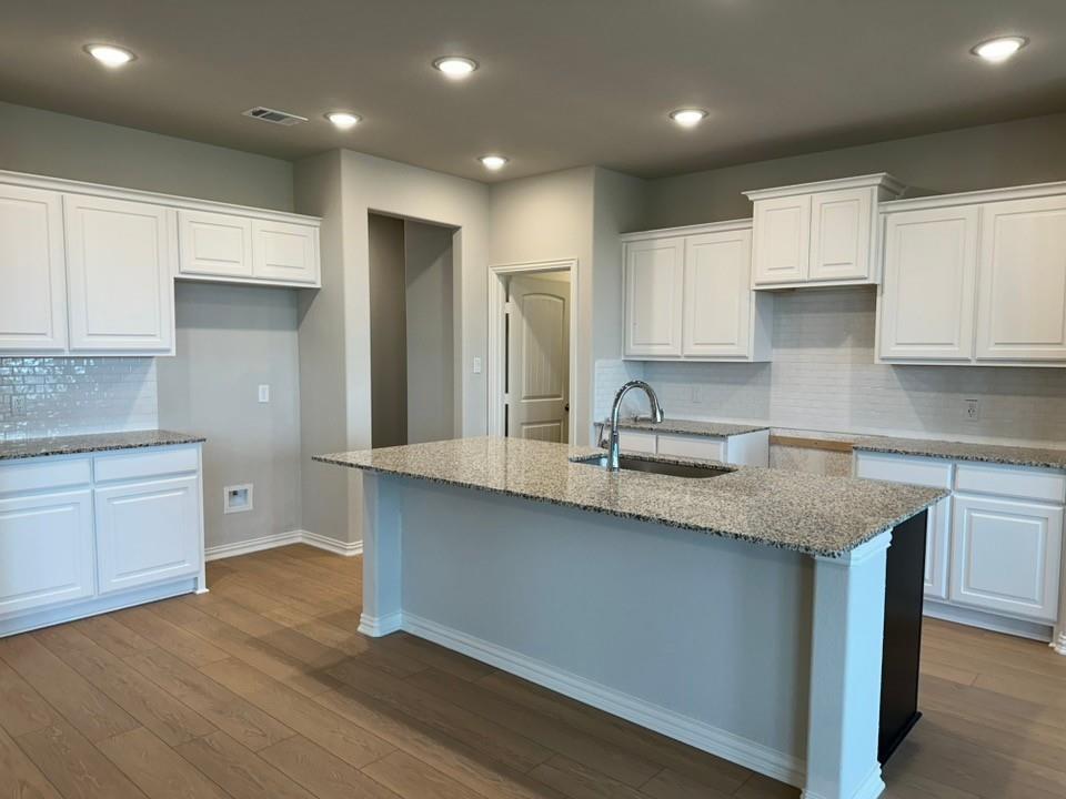 2472 Black Jack Oak Road Terrell, TX 75161 - Photo 6 of 27 a kitchen with stainless steel appliances granite countertop a sink a stove a refrigerator and cabinets