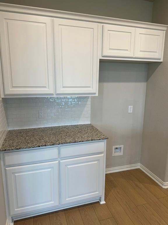 2472 Black Jack Oak Road Terrell, TX 75161 - Photo 7 of 27 a kitchen with granite countertop white cabinets and a sink