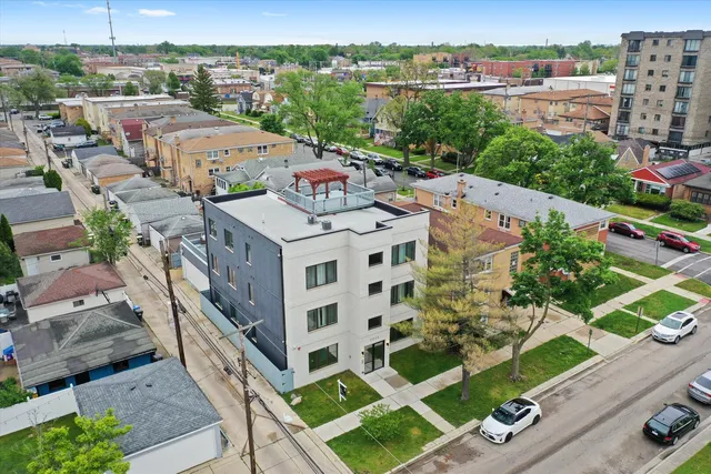 an aerial view of a house with a garden