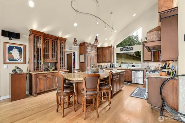 a kitchen that has a sink and a stove