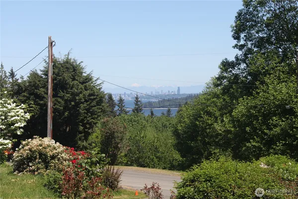 a view of a garden with a building in the background