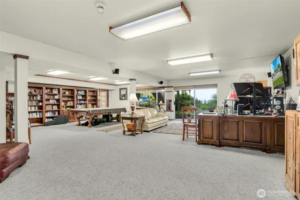 a room with furniture and gym equipment