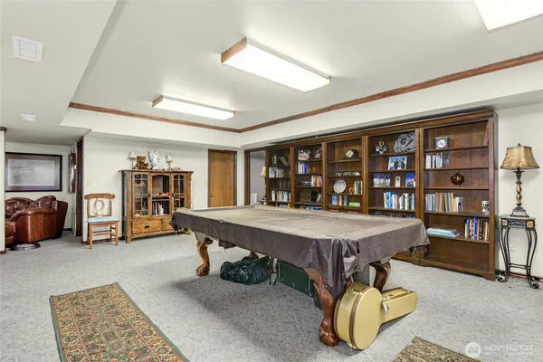 a bed sitting in a room next to a window