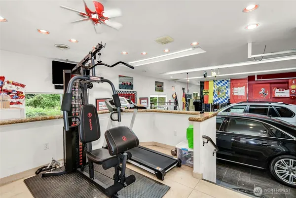 a utility room with lots of appliances and cabinets