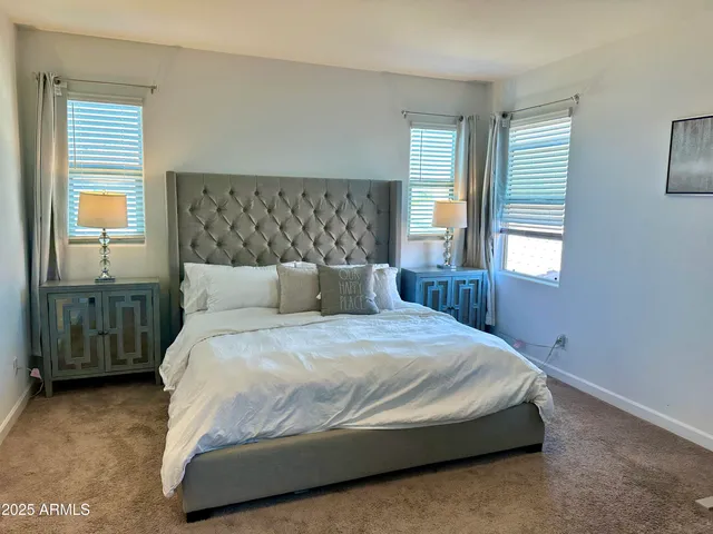 a bedroom with a bed and window