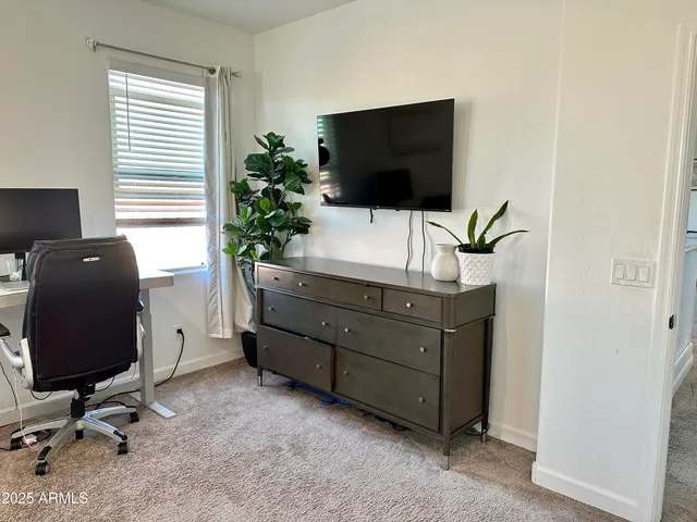 a room with furniture and flat screen tv