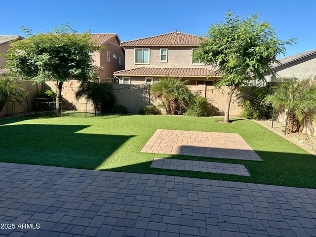 a view of a house with a yard and plants