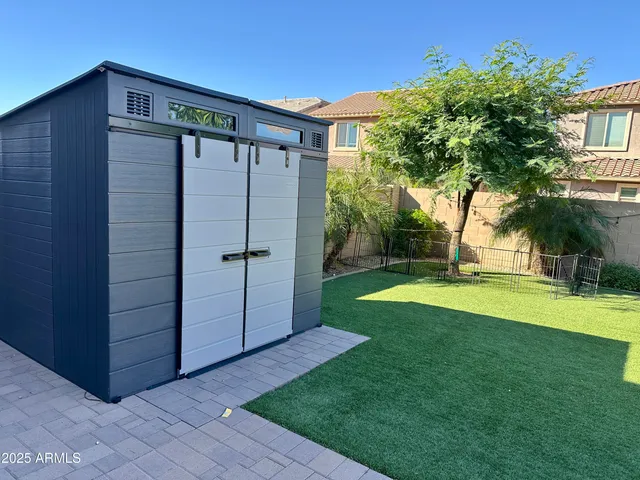 a view of a back yard of the house
