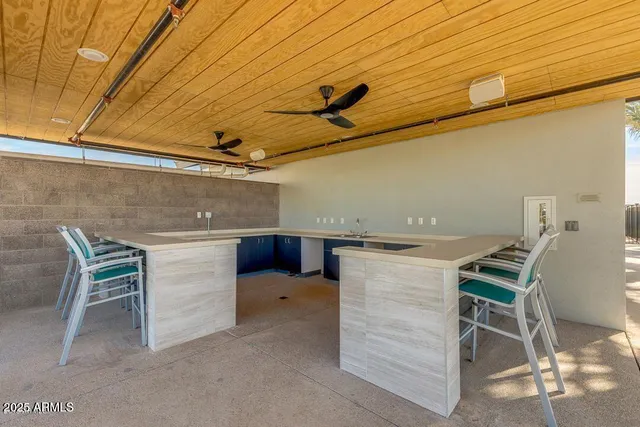 a view of a kitchen with a table and chairs