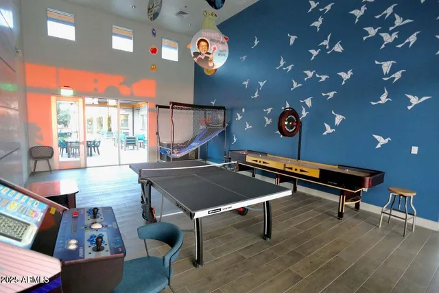 a room with furniture a rug and a chandelier