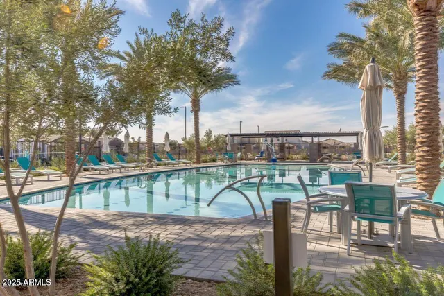 a view of a lake with a table and chairs