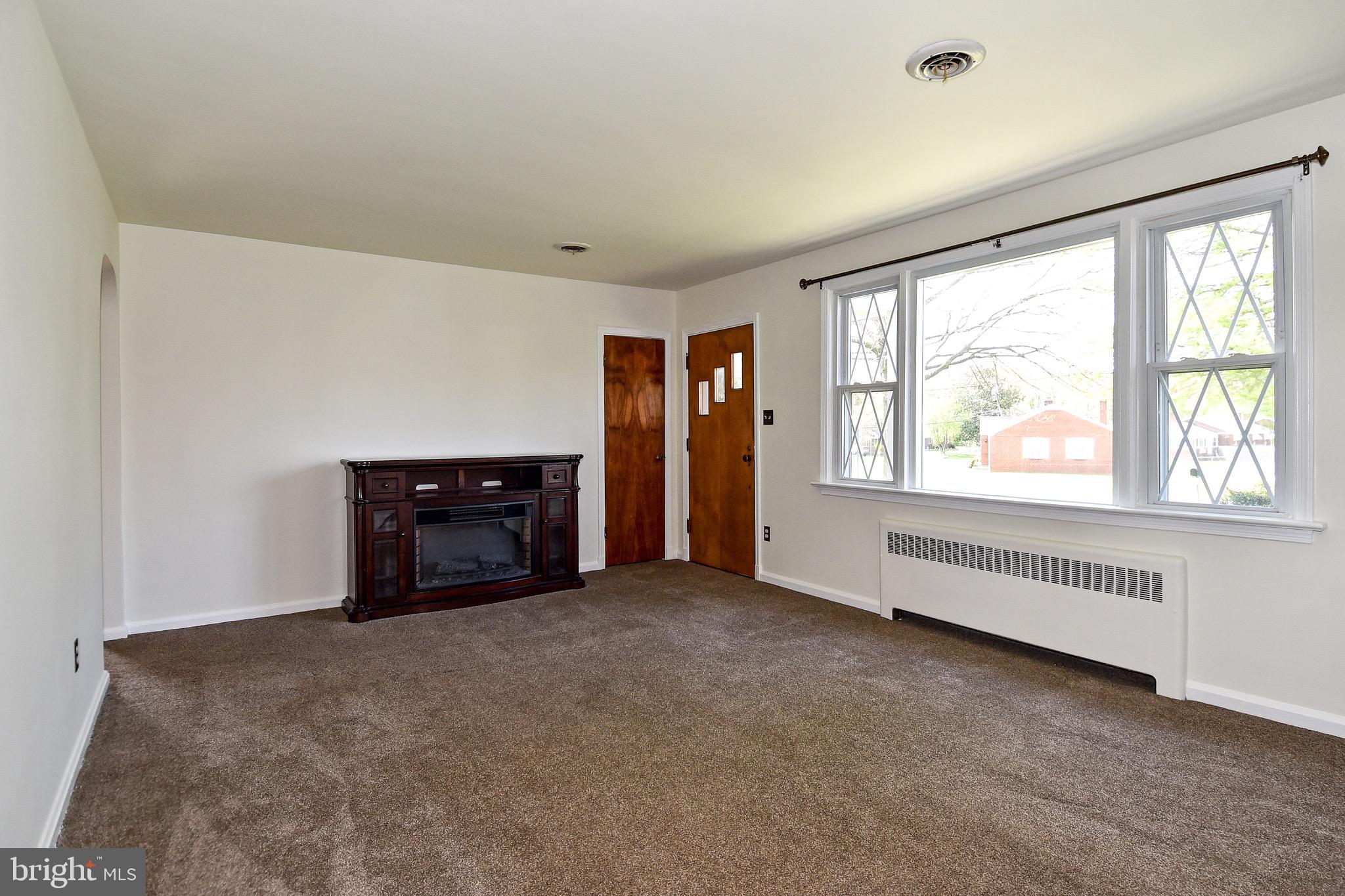 4512 Harvest Road Temple Hills, MD 20748 - Photo 4 of 23 Living Room with electric fireplace