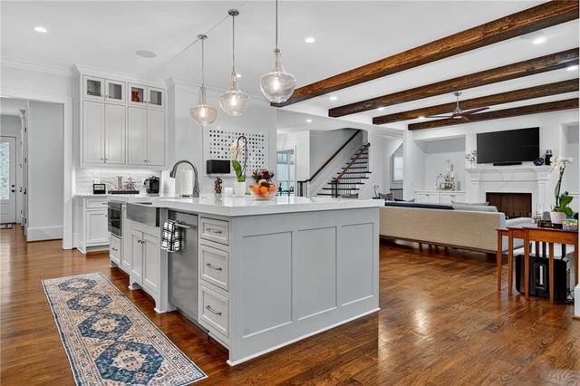 a living room with furniture fireplace and flat screen tv