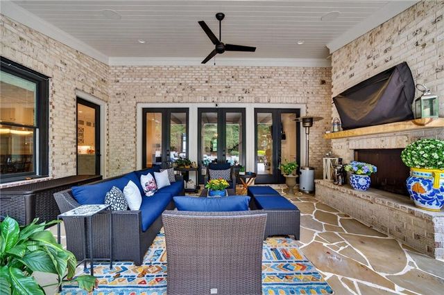 a kitchen with a sink cabinets and wooden floor