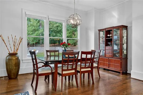 a bedroom with a bed a couch and a window