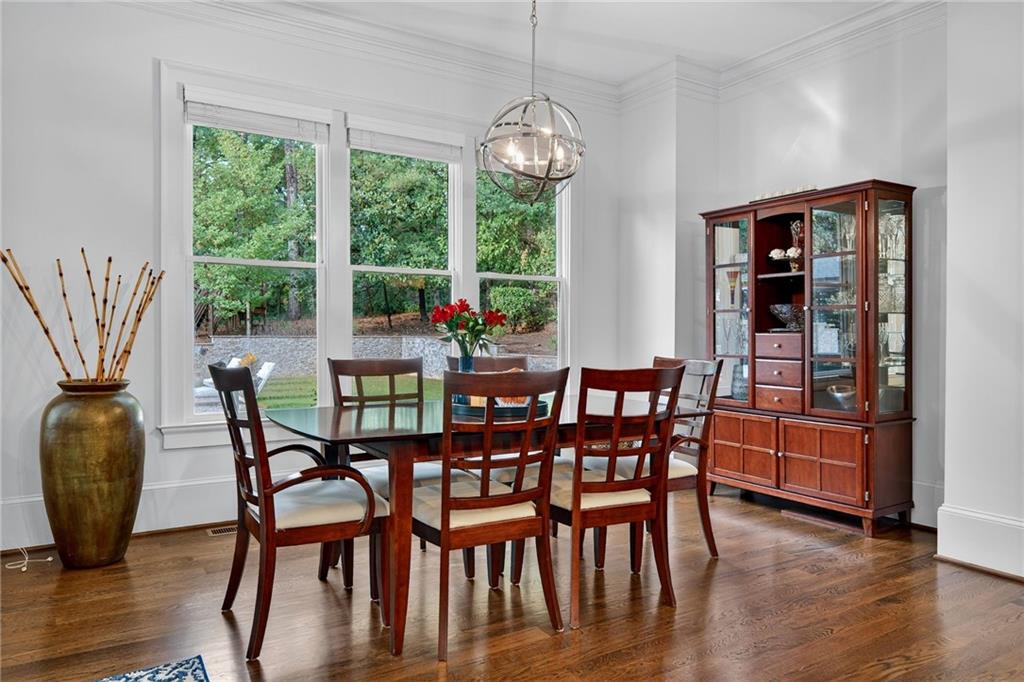 976 Ferncliff Road Northeast Atlanta, GA 30324 - Photo 16 of 58 a view of a dining room with furniture window and wooden floor