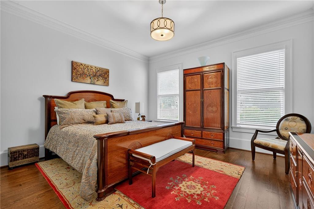 976 Ferncliff Road Northeast Atlanta, GA 30324 - Photo 18 of 58 a bedroom with a bed a couch and a window