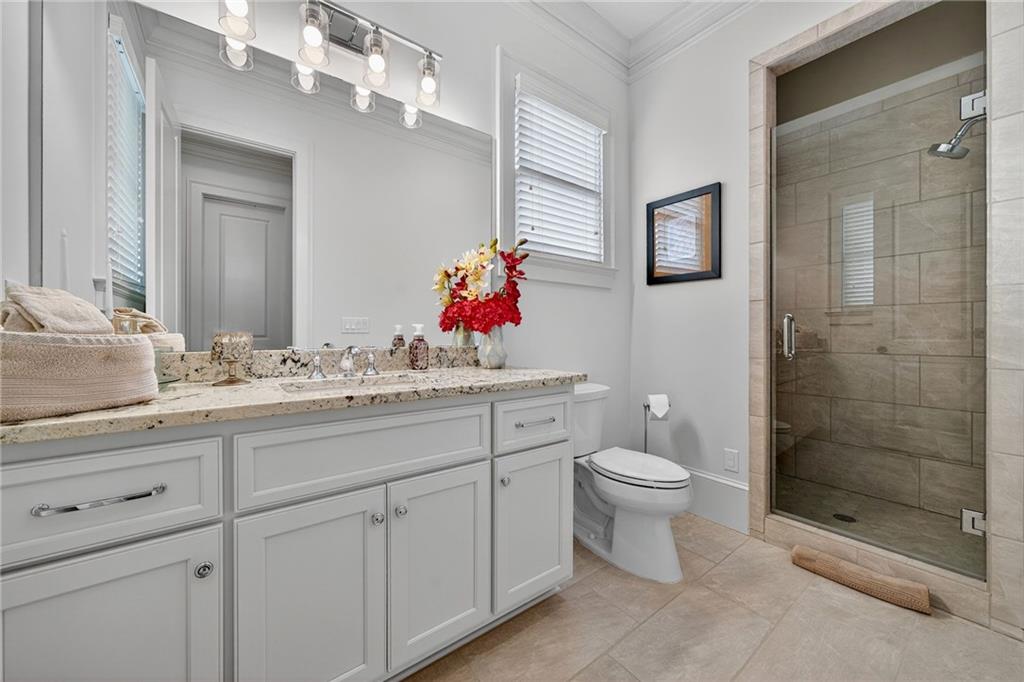 976 Ferncliff Road Northeast Atlanta, GA 30324 - Photo 20 of 58 a bathroom with a toilet sink and shower