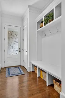 a bed room with a bed and a chair