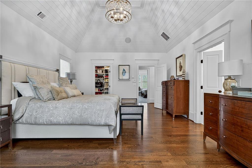 976 Ferncliff Road Northeast Atlanta, GA 30324 - Photo 24 of 58 a spacious bedroom with a bed and a table