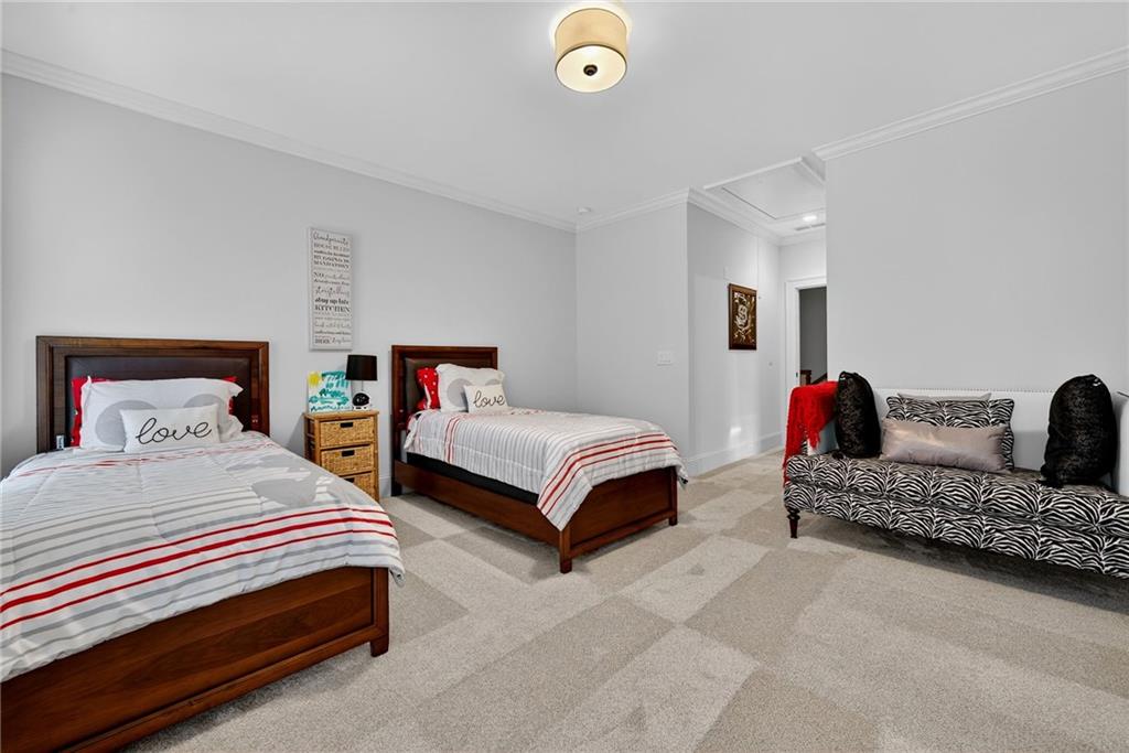 976 Ferncliff Road Northeast Atlanta, GA 30324 - Photo 29 of 58 a bedroom with a bed and a couch