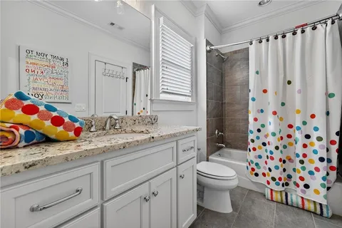a bathroom with a sink vanity and mirror