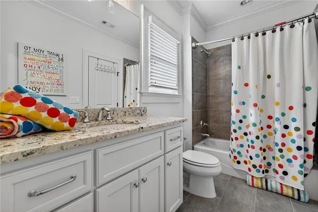 a bathroom with a sink vanity and mirror