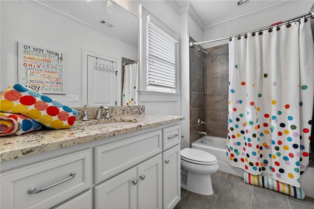 976 Ferncliff Road Northeast Atlanta, GA 30324 - Photo 30 of 58 a bathroom with a sink toilet and shower